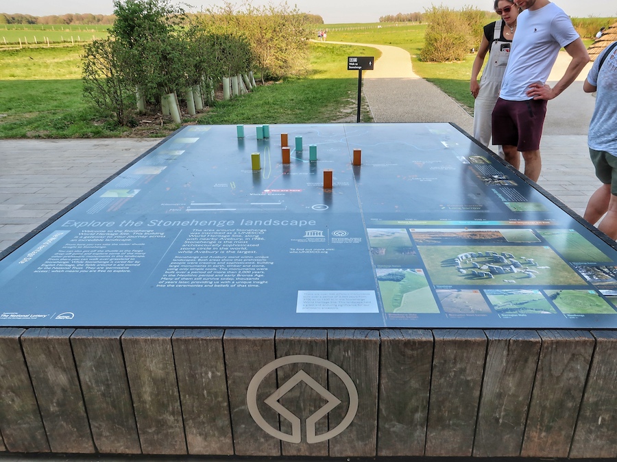 Visitors stare at a map found at the Stonehenge Visitor Centre