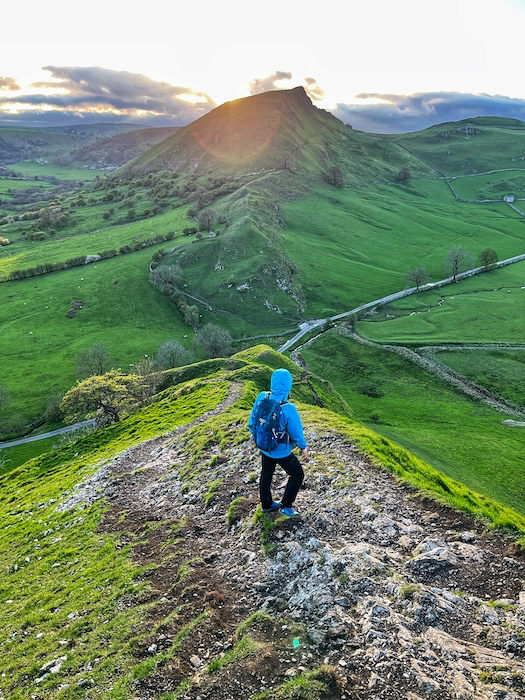 Walker looking across the ridge towards Chrome Hill in the Peak District