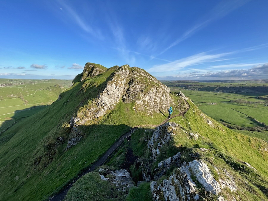 Rocky ridge path on Chrome Hill in the Peak District with wide valley views