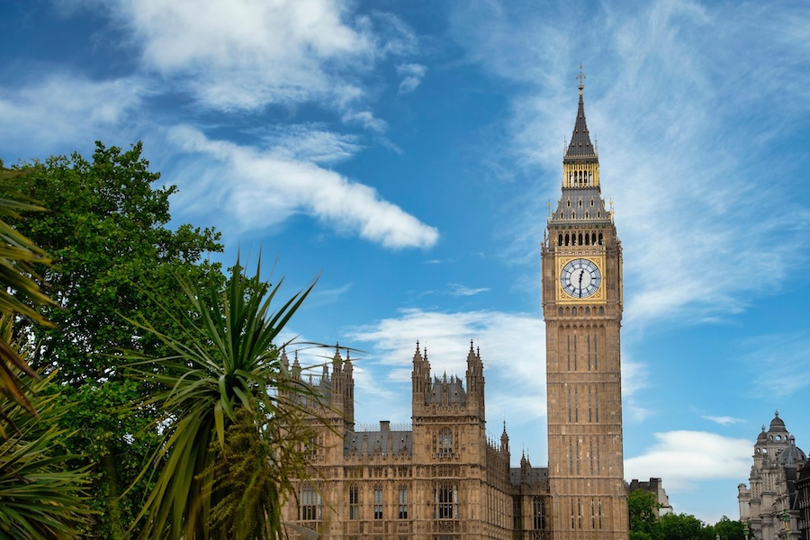 Big Ben and the Houses of Parliament beneath a blue sky in Westminster, London