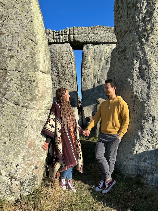 Visitors standing among the stones at Stonehenge during summer solstice